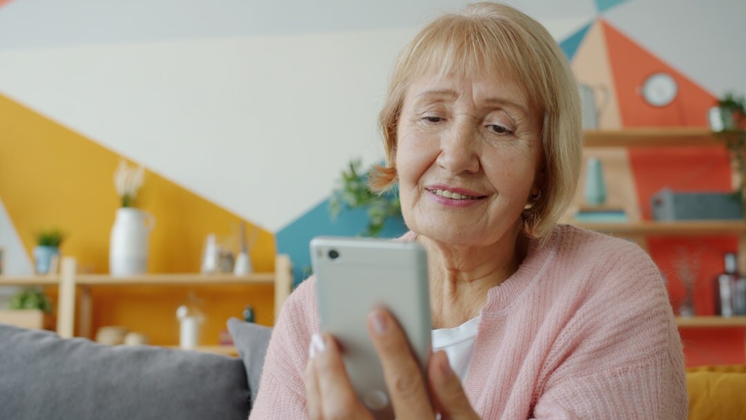 elderly woman talking at home