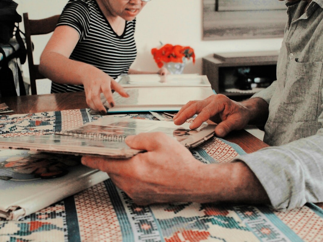 elderly man showing old photos
