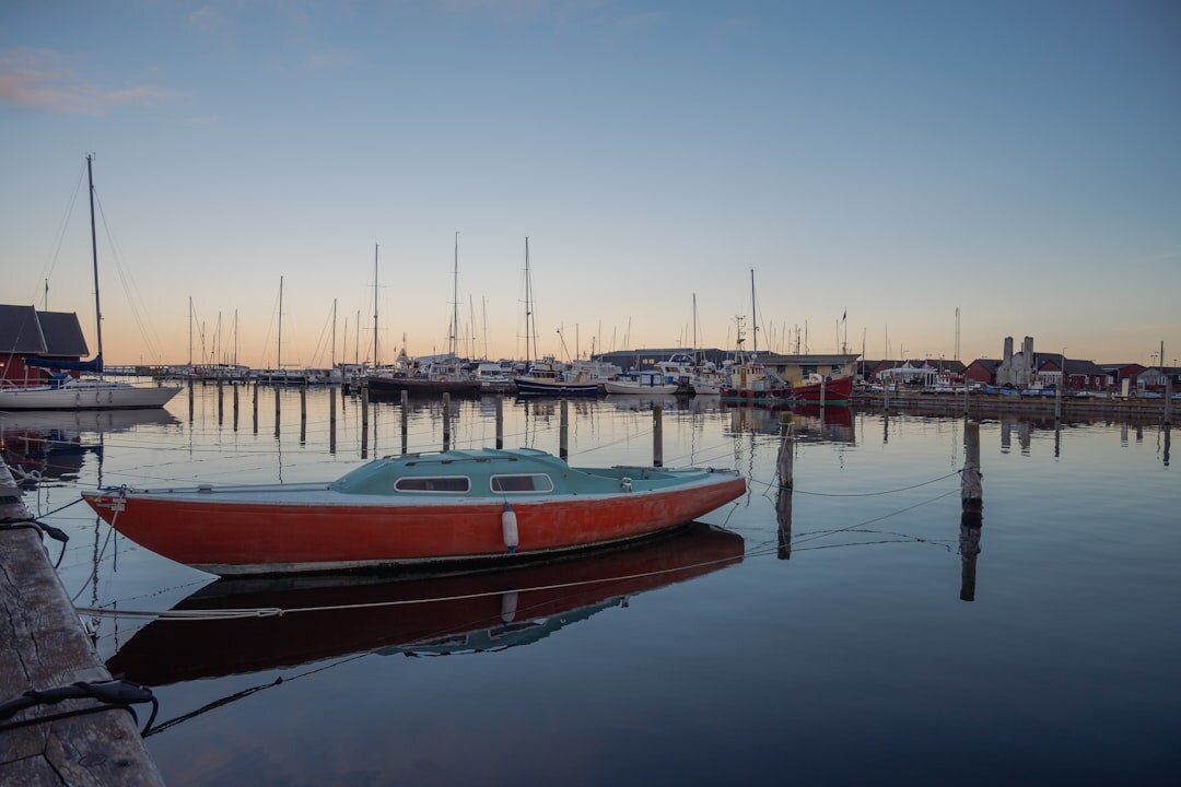 Fishing harbor in Denmark at dawn with wooden boats