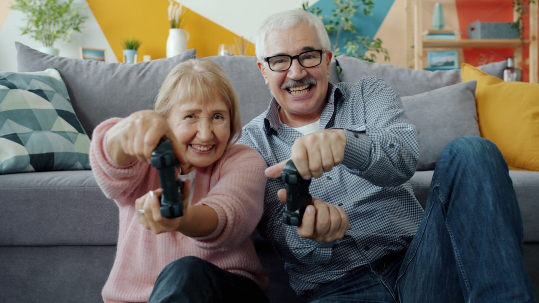 Elderly Danish couple sitting together at a kitchen table
