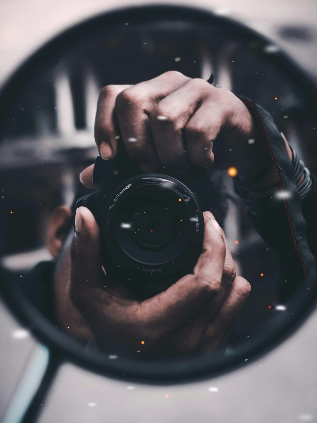 Portrait of a Danish documentary photographer holding a camera